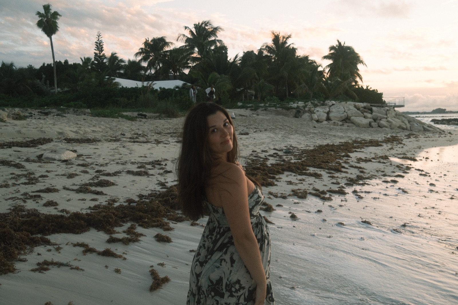 emma liuzzi on the beach at dusk